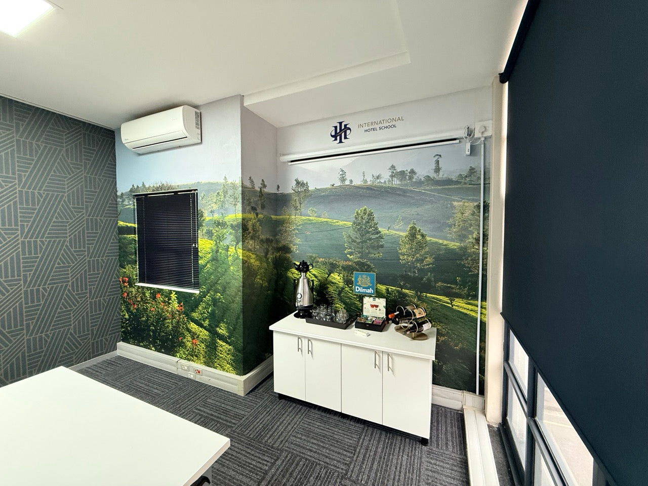Custom botanical wallpaper installation in the Dilmah boardroom
