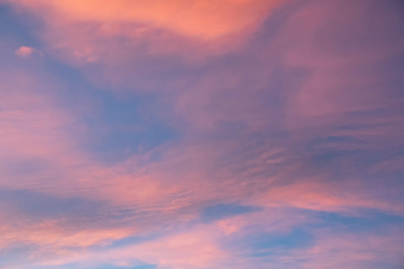 Pink evening clouds creating a calming sky view.
